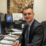 Itinai.com a photo of a recruiter at his workstation. he is wea 19d962b9 02ce 441a 8c9b 9689e6ea40f3